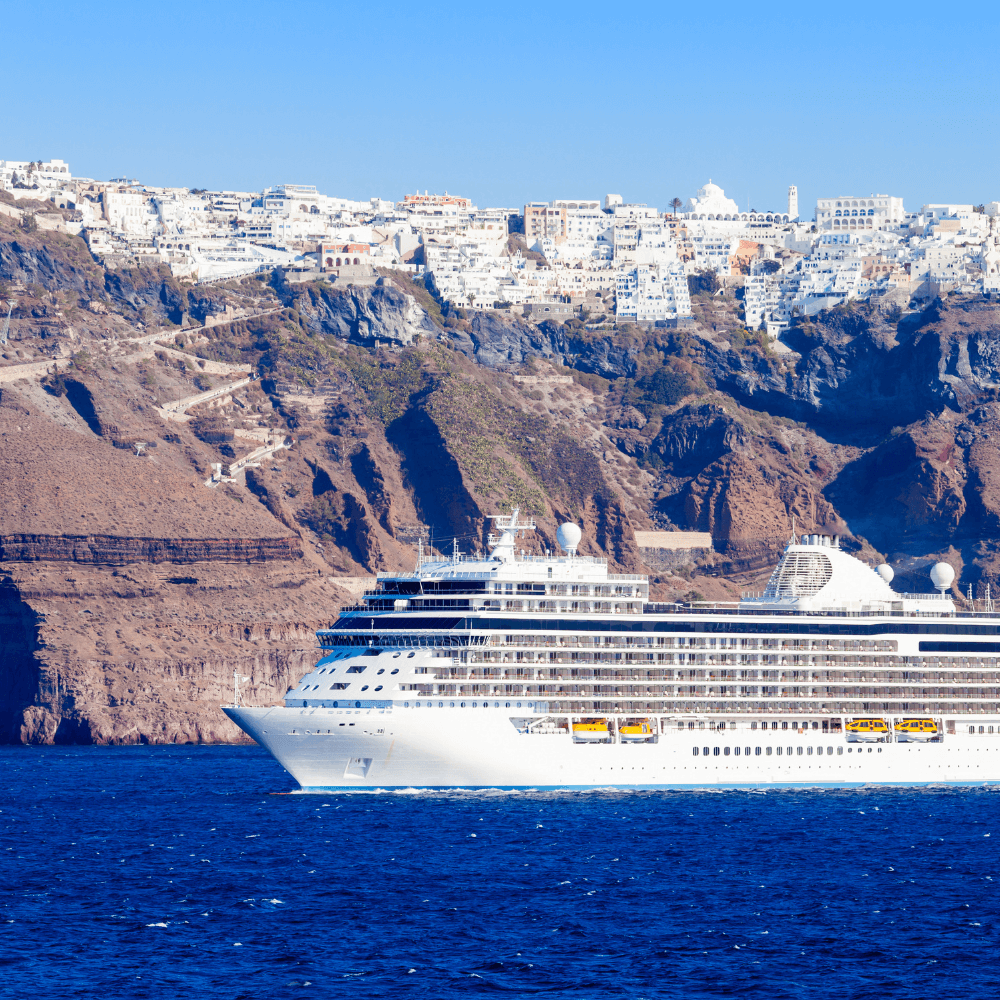 Cruise ship in the water near a city