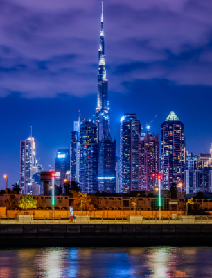 Night view of city skyline with Burj Khalifa illuminated